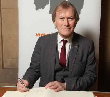 Sir David honours victims of the Holocaust